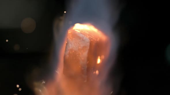 Slow motion of torch heating up piece of metal