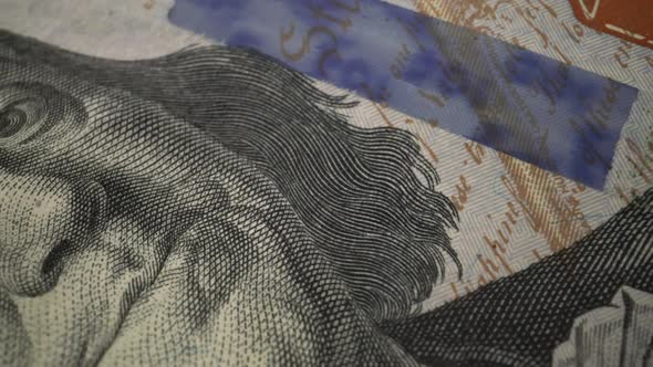 American one hundred dollar paper banknote in close up macro view dolly shot.