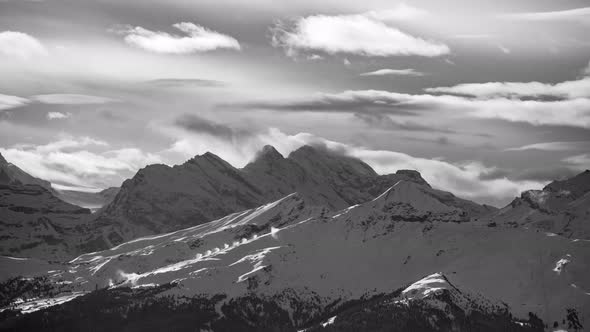 Black and white timelapse Bluemlisalp, Lauberhorn and Tschuggen in wintertime. Seen from Grindelwald
