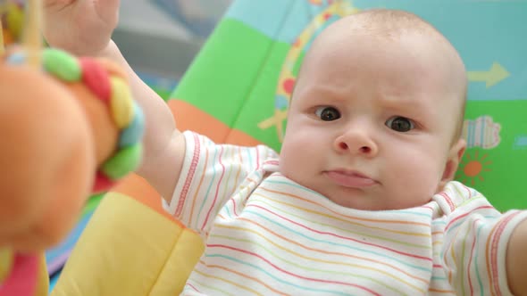 Angry Baby Face. Portrait of Cute Infant Emotion. Funny Childhood. Cheerful Kid