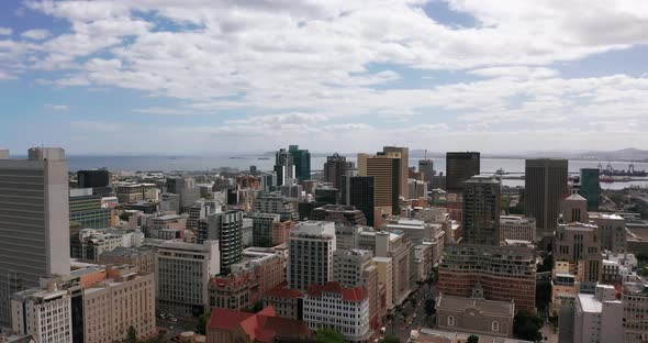 Wide Aerial Shot Tracking Forward Into the City of Cape Town During a Spectacular Sunset with Table