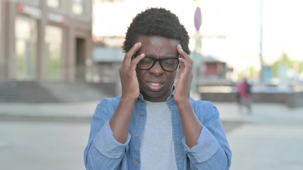 Young African Man Having Headache Outdoor