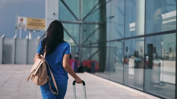 Active Female Passenger Going to Flight Gate Carrying Suitcase Enjoying Summer Travel Vacation