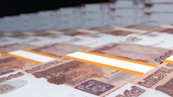 Many wads of money. 5000 russian ruble banknotes. Stacks of money.