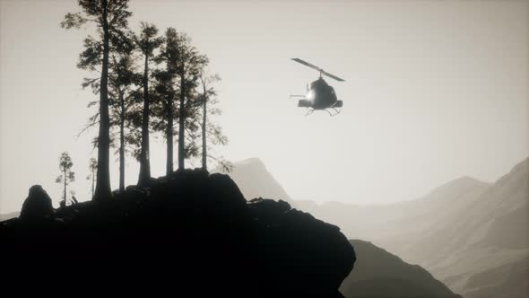 Extreme Slow Motion Flying Helicopter Near Mountain Forest