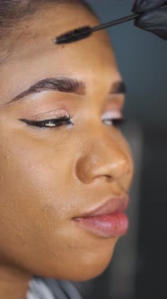 African Girl Doing Eyebrow Correction in Beauty Salon
