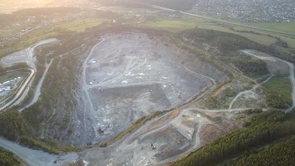 Old Mining Machines on Gravel Quarry with Huge Heaps