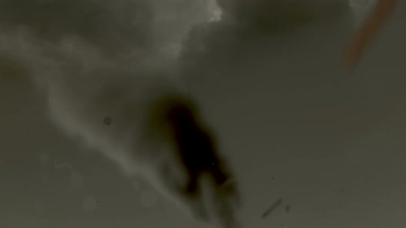 Tornado With The Funnel Tube Reaching From The Cloud To The Ground