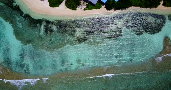 Luxury overhead island view of a sunshine white sandy paradise beach and blue sea background in vibr