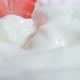 Fresh strawberries fall into yogurt. Organic ripe strawberry. Close up - VideoHive Item for Sale