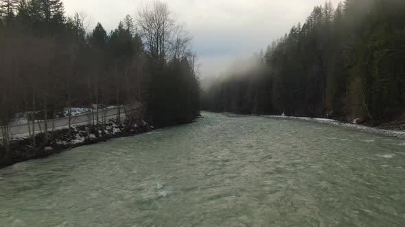 Aerial View of Chilliwack River with Snow During Winter Season