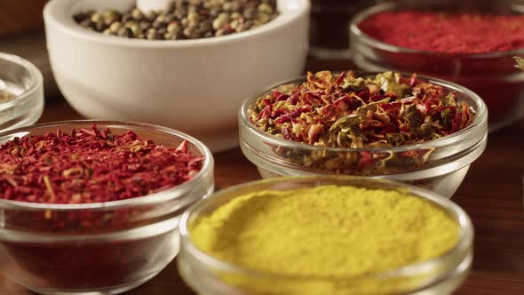 Various Spices in Glass Bowls Closeup