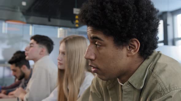 Closeup Diverse Group People Sitting in Row Students Classmates Sitts in Classroom at Lesson