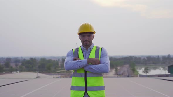 Portrait of engineer man or worker, people, crossing arms, working on solar panels or solar