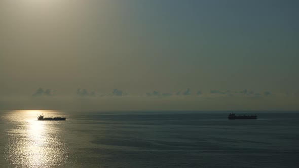 Romantic colorful sunset at the sea. Against the background of the sea the sun goes down