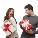 Young Couple Showing Presents in Chrismas Day on White Background. - VideoHive Item for Sale