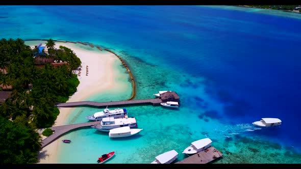 Aerial drone shot nature of exotic resort beach journey by blue ocean with white sandy background of