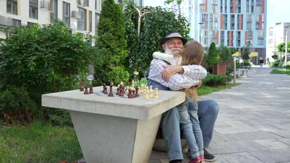 Grandpa Hugs and Kisses His Lovely Granddaughter