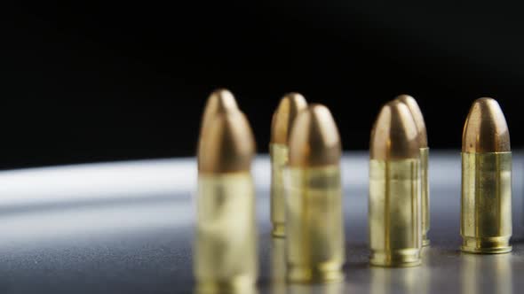 Cinematic rotating shot of bullets on a metallic surface - BULLETS 032