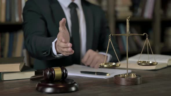 Close Up Shoot of Judge Hand Shaking Offer in Court Room 