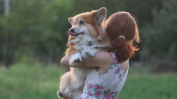 Smiling Woman Holding A Dog 3