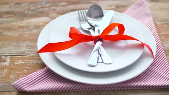 Cutlery Tied with Red Ribbon on Plate 28