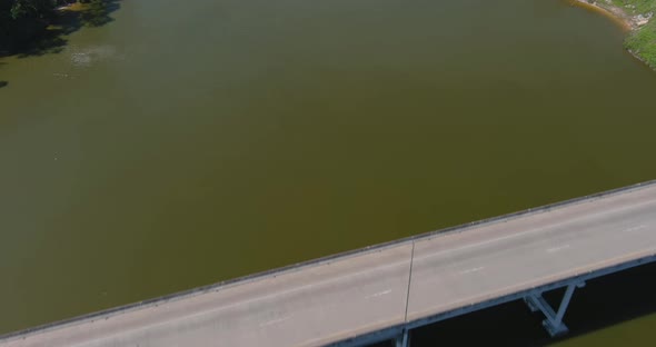 Aerial of cars driving on bridge that crosses over the San Jacinto River in Houston, Texas