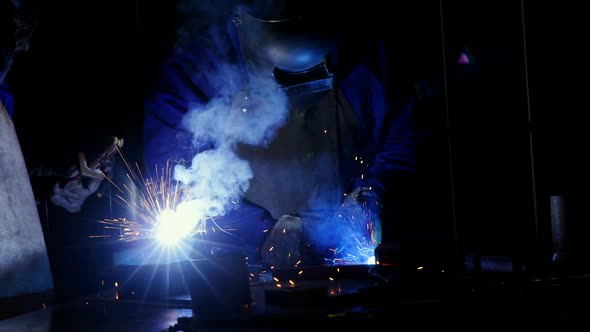 Welder welding a metal