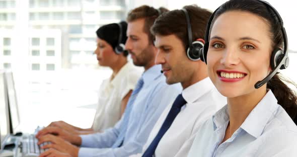 Smiling Call Centre Agent Looking to Camera