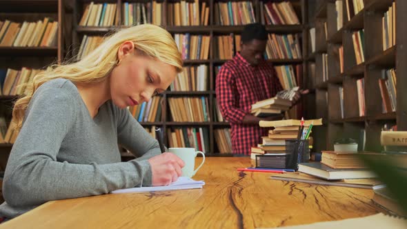 Mixed Race Students are Studying in Library