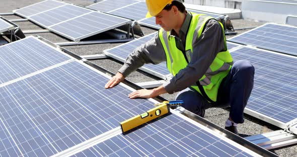 Male worker working at solar station 4k