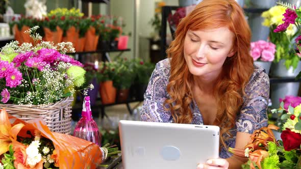 Female florist using digital tablet in florist shop