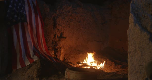 Fire Burning Near USA Flag at Night