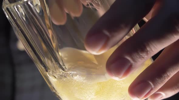 Pouring Beer Into A Glass Mug