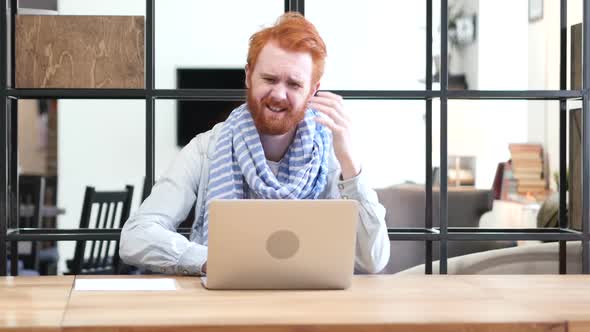 Man Upset by Loss while Working Online