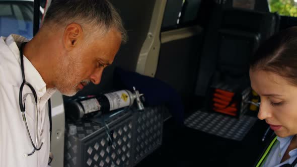 Emergency medical technician placing an oxygen mask