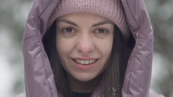 Closeup Face of Confident Beautiful Brunette Woman with Brown Eyes and Toothy Smile Looking at