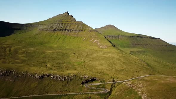 Aerial View of a Faroese Mountains with a Scenic Road Faroe Islands