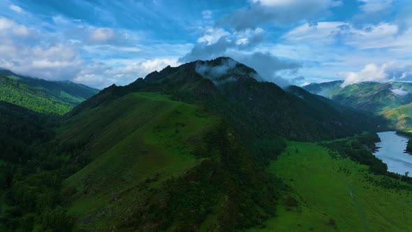 Landscape of mountains in summer. Fog. Aerial view