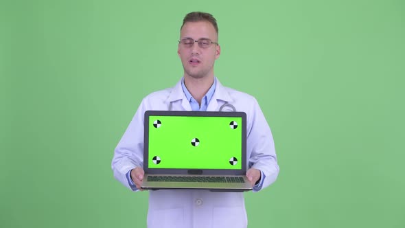 Stressed Man Doctor Showing Laptop and Getting Bad News