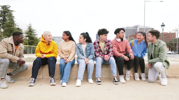 Many Students Sitting Talking About Homework Outdoors