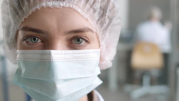 Portrait of Face of Female Scientist in Lab