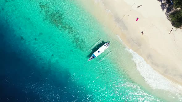 Aerial texture of marine sea view beach trip by turquoise sea and white sand background of a dayout 