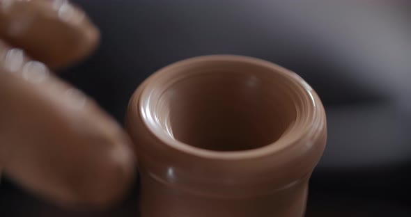 MACRO SHOT Potter Sculpts a Small Ceramic Glass in Slow Motion on a Potter's Wheel Small Forms in