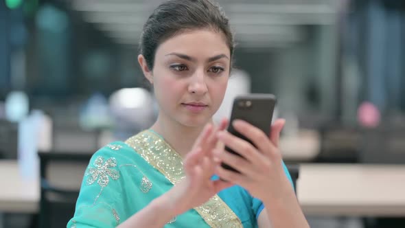 Young Indian Woman using Smartphone