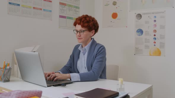 Portrait of Female Science Teacher in Classroom