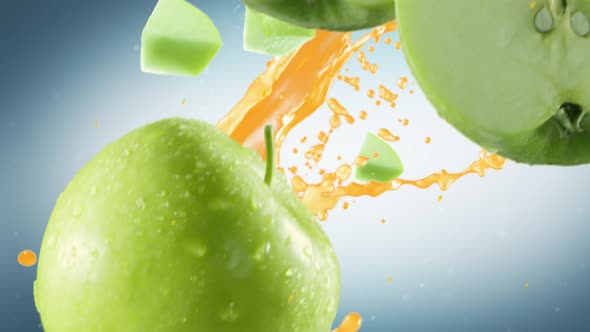 Green Apple with Slices Falling on Cyan Background