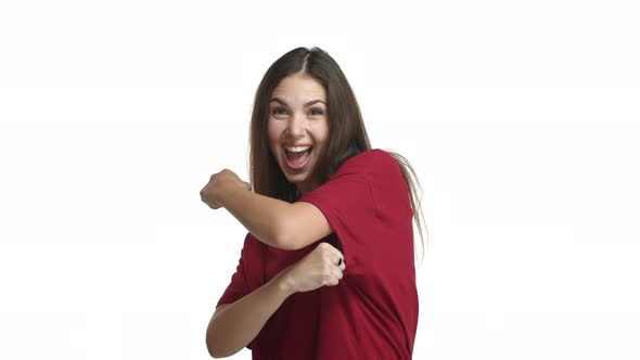 Happy Brunette Girl in Red Tshirt Cheering Up Praising Good Work and Smiling Pleased Supporting