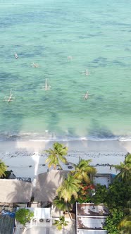 Vertical Video Boats in the Ocean Near the Coast of Zanzibar Tanzania