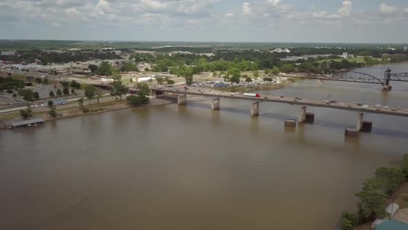 Aerial shot panning I-40 bridge over the Arkansas river downtown Little Rock Arkansas.